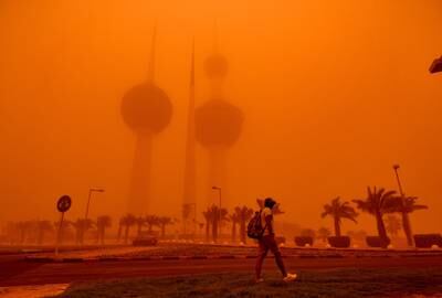 The Kuwait Towers are shrouded amid a sandstorm. The world has seen more extreme weather in the past decade, with the Gulf witnessing cyclones, flooding and extreme heat. EPA