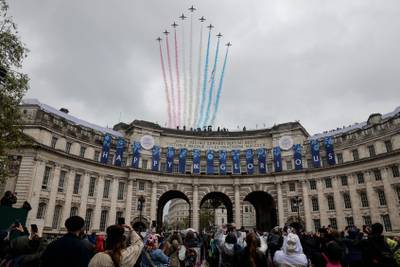 The British Royal Air Force's aerobatic team, the Red Arrows, perform a fly-past over Admiralty Arch in central London. AFP