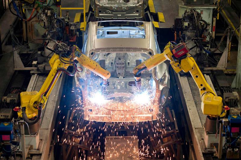 (FILES) In this file photo taken on November 12, 2014 Robots weld vehicle panels in the Body Shop at the Nissan Sunderland Plant in North East England on November 12, 2014. 
Britain's top businesses are cranking their Brexit plans into gear, shifting operations abroad to ensure a smooth transition when the nation quits the European Union in one year's time. Nissan boss Carlos Ghosn approved new investments at Sunderland plant in northeast England, after the Japanese giant received private guarantees from London over Brexit.
 / AFP PHOTO / Oli SCARFF