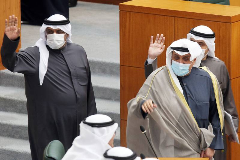 Kuwait’s Deputy Prime Minister and Interior Minister Sheikh Ahmad Al Mansour, Deputy Prime Minister and Defence Minister Sheikh Hamad Jaber and Foreign Minister Sheikh Ahmad Nasser Al Mohammed walk together during a parliament session. AFP