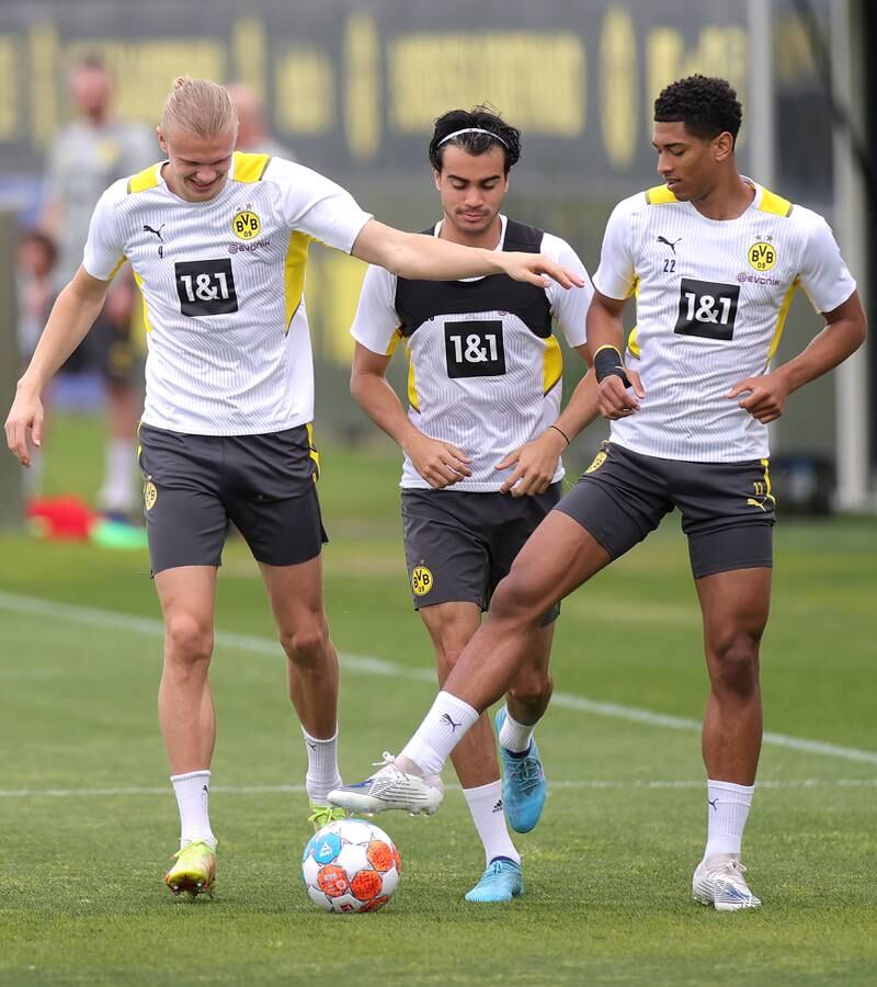 Dortmund's Erling Haaland, left, with Reinier, centre, and Jude Bellingham during training on Tuesday. EPA