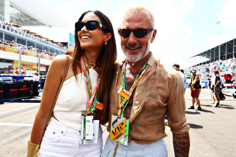 Model Sharon Fonseca and Gianluca Vacchi pose for a photo on the grid during the F1 Grand Prix of Miami. Getty
