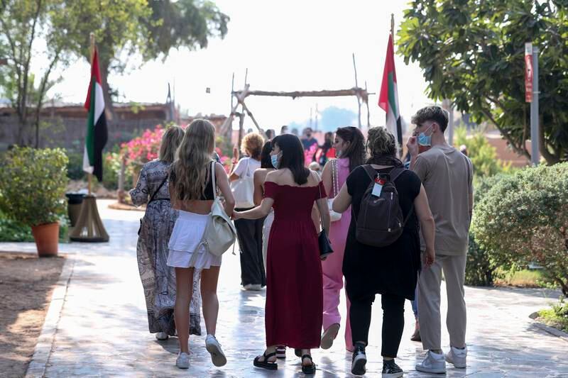 Tourists at the Heritage Village at Abu Dhabi's Corniche. Government initiatives have help the sector rebound from the pandemic. Khushnum Bhandari / The National
