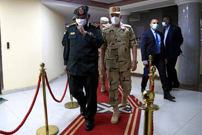 Sudanese military Chief of Staff Mohamed Othman al-Hussein escorts his Egyptian counterpart Mohamed Farid following a meeting of the Egyptian-Sudanese military committee in Sudan's capital Khartoum. AFP