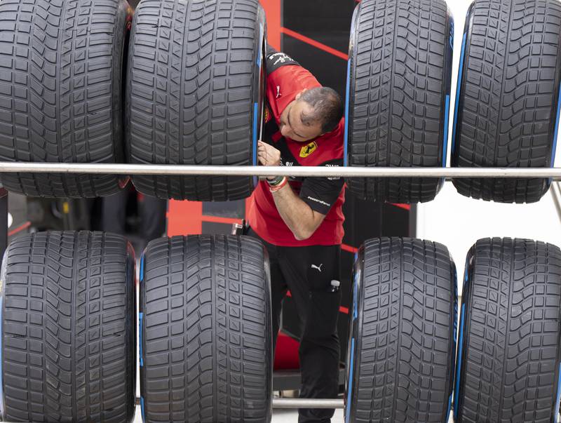 A Ferrari mechanic checks a tyre's pressure at the Formula 1 Canadian Grand Prix, in Montreal.  AP