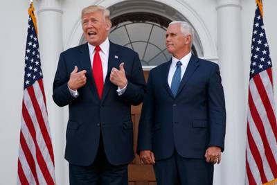 President Donald Trump, accompanied by Vice President Mike Pence, speaks to reporters before a security briefing at Trump National Golf Club in Bedminster, N.J., Thursday, Aug. 10, 2017,  (AP Photo/Evan Vucci)
