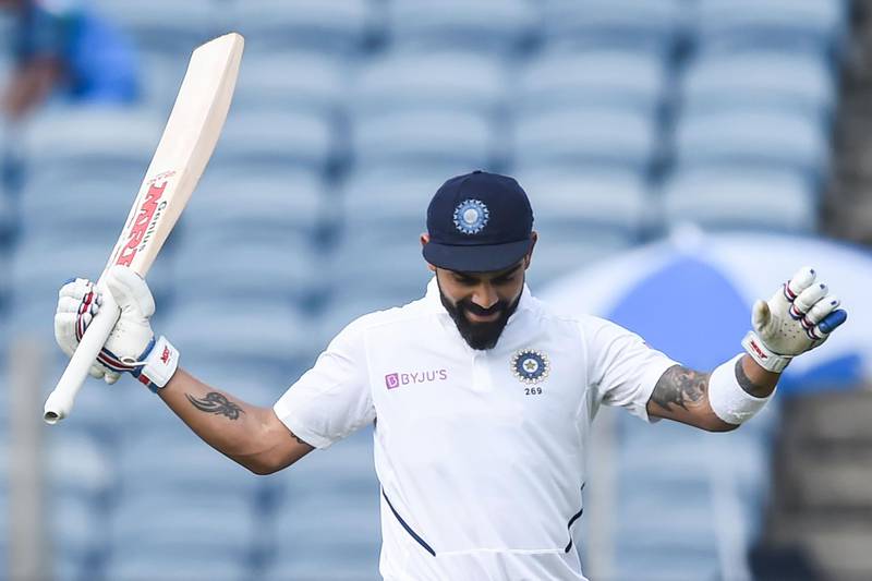 India's cricket team captain Virat Kohli celebrates after scoring a double century (200 runs) during the second day of the second Test cricket match between India and South Africa at Maharashtra Cricket Association Stadium in Pune on October 11, 2019. IMAGE RESTRICTED TO EDITORIAL USE - STRICTLY NO COMMERCIAL USE
 / AFP / Punit PARANJPE / IMAGE RESTRICTED TO EDITORIAL USE - STRICTLY NO COMMERCIAL USE
