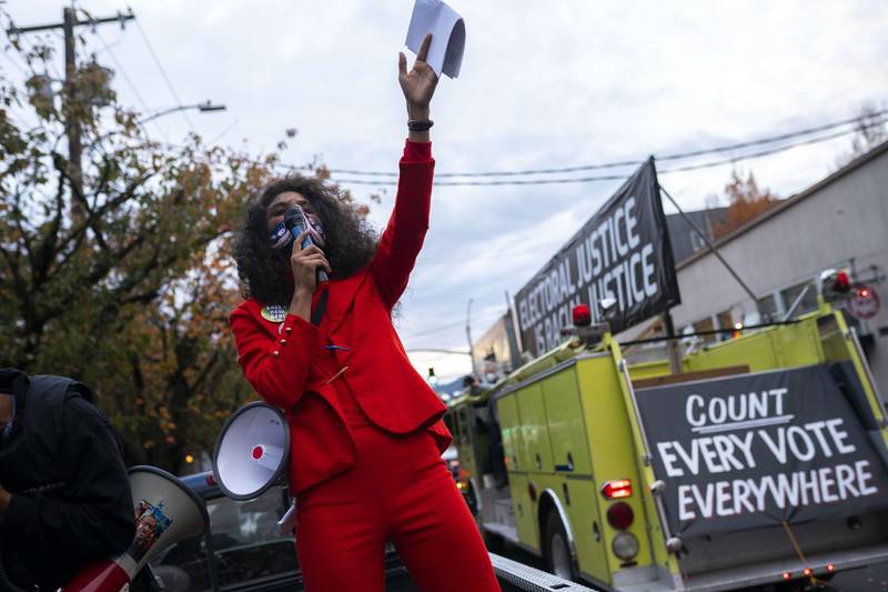 A speaker leads a crowd in chants in Portland, Oregon. AFP