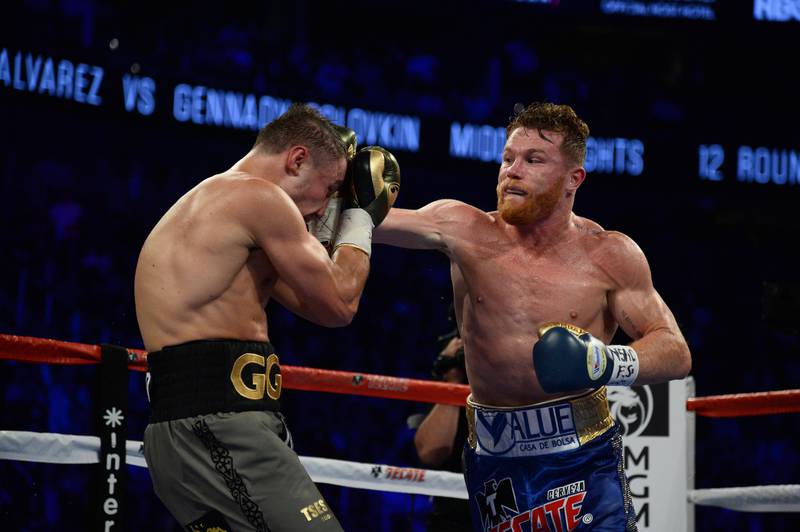 Sep 16, 2017; Las Vegas, NV, USA; Gennady Golovkin (green trunks) and Canelo Alvarez (blue trunks) box during the world middleweight boxing championship at T-Mobile Arena. The bout ended in a draw. Mandatory Credit: Joe Camporeale-USA TODAY Sports
