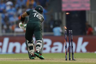Pakistan's Mohammad Rizwan is bowled out by India's Jasprit Bumrah. Reuters
