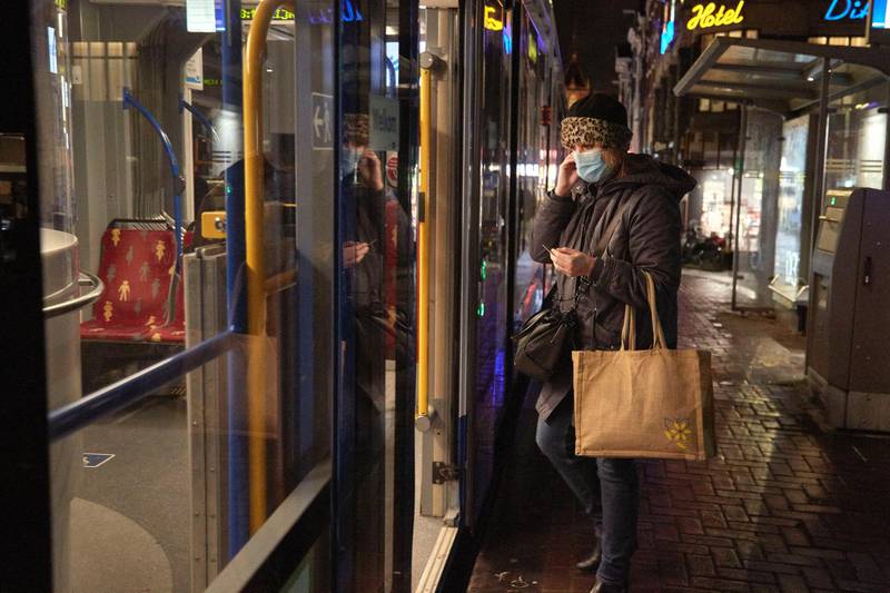 A woman enters a tramway in Amsterdam, Netherlands. Getty Images
