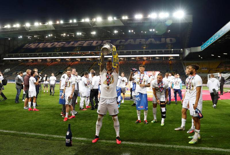Leeds United's Liam Cooper celebrates winning the Championship. Reuters