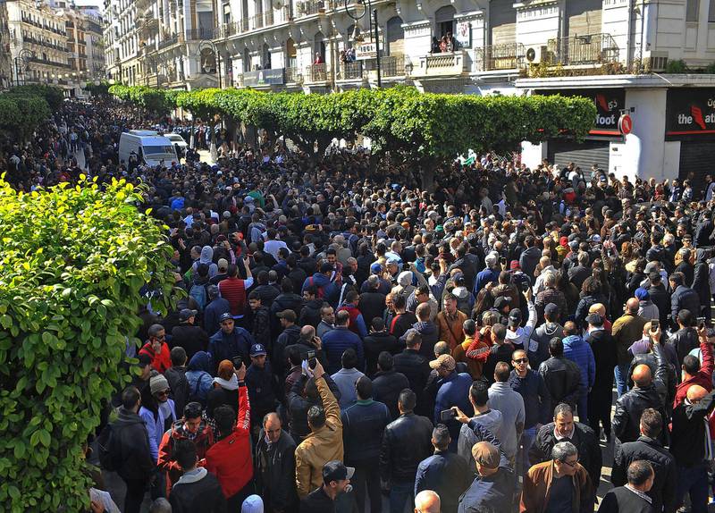 Demonstrators gather during a protest to denounce President Abdelaziz Bouteflika's bid for a fifth term, in Algiers, Algeria, Sunday, Feb. 24, 2019. Hundreds of protesters have gathered in Algeria's capital for the second time this week to denounce ailing President Abdelaziz Bouteflika's bid for a fifth term. (AP Photo/Guidoum Fateh)