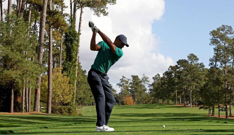 Tiger Woods plays his shot from the 17th tee during a practice round prior to the Masters at Augusta National Golf Club. AFP