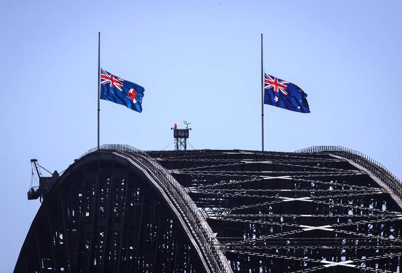 Flags on Sydney Harbour Bridge fly at half-mast, in Sydney, Australia. Getty Images