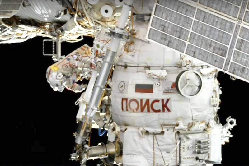 Roscosmos' cosmonauts Oleg Artemyev and Denis Matveev work on the robot arm. Roscosmos Space Agency via AP
