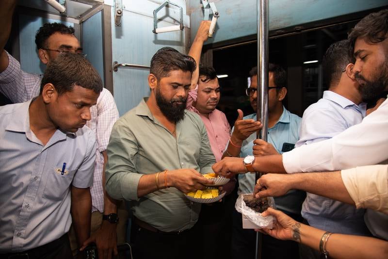 Mr Najeeb is part of a group of Hindu and Muslim friends who share iftar aboard the train as they commute back to Palghar from Mumbai 