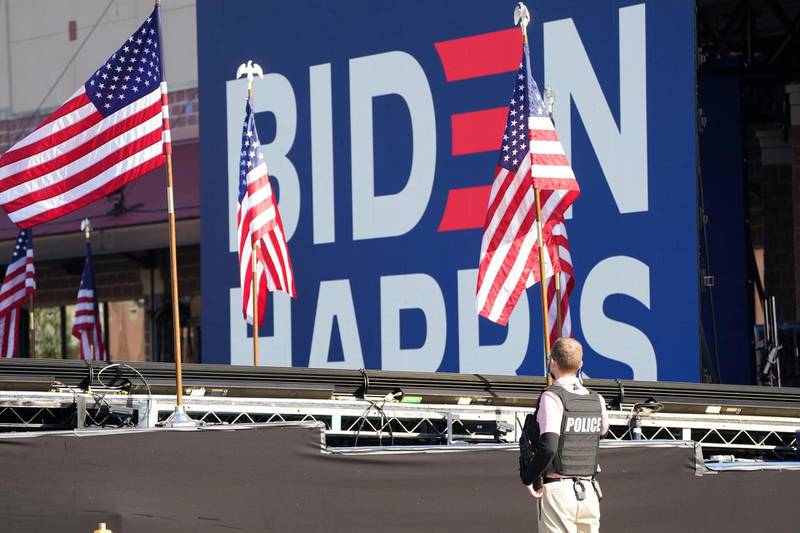 A police officer stands watch near a stage set up by the campaign of Democratic presidential nominee Joe Biden in Wilmington, Delaware. Reuters