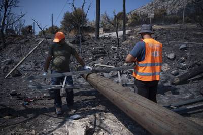 Wildfire destruction in the Fyli suburb of northwest Athens, Greece. AP