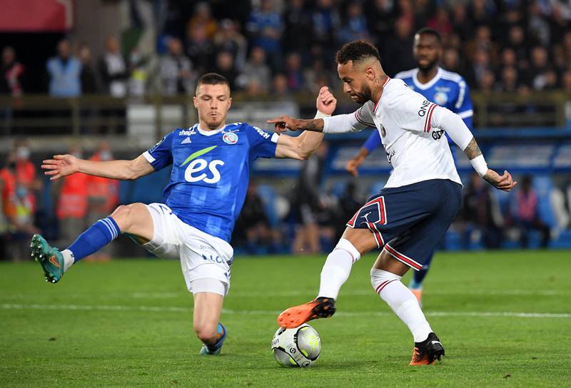 Neymar fights for the ball with Strasbourg's defender Frederic Guilbert at the La Meinau Stadium. AFP
