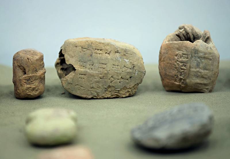 Iraq's Ministry of Antiquities displays some of the 337 artifacts that were stolen in the weeks after the fall of Saddam Hussein's regime in 2003. AP