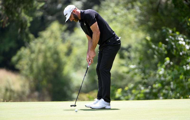 Dustin Johnson sinks a birdie putt on the fourth hole during round two of the LIV Golf Invitational - Portland. Getty