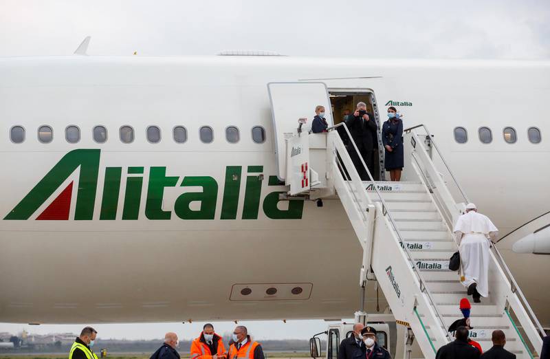 Pope Francis boards a plane for his visit to Iraq, at Leonardo da Vinci-Fiumicino Airport in Rome, Italy, March 5, 2021. REUTERS/Remo Casilli