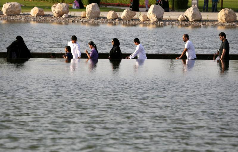 Visitors are seen crossing the lake at Dubai's Quranic Park in Dubai, UAE April 6, 2019. Picture taken April 6, 2019. REUTERS/Satish Kumar