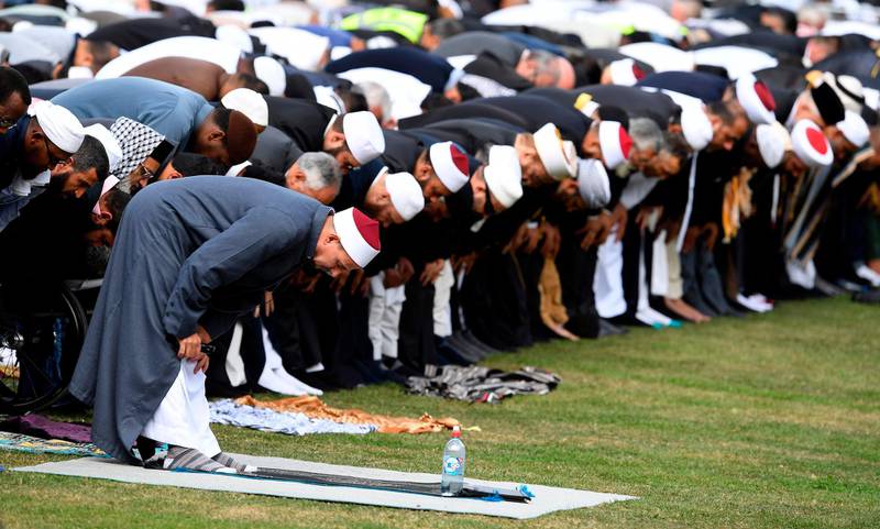 People pray during congregational Friday prayers and two minutes of silence for victims at Hagley Park. AFP