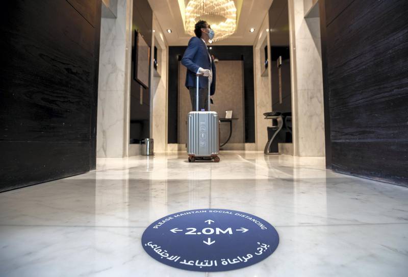 Abu Dhabi, United Arab Emirates, July 12, 2020.   Sofitel Abu Dhabi Corniche Hotel with updated Covid-19 precautionary measures.  A distance sign on the elevator lobby of the hotel.Victor Besa  / The NationalSection:  StandaloneReporter: