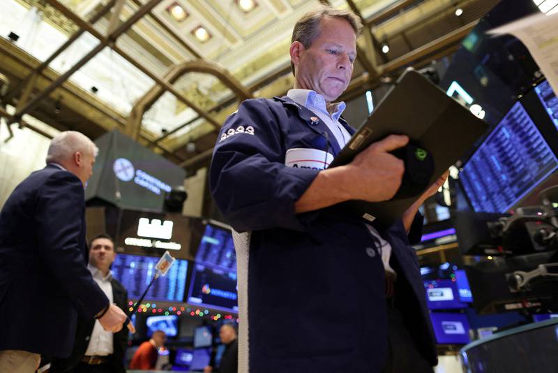 A trader at the New York Stock Exchange. US non-farm payrolls exceeded expectations as employers added 223,000 jobs in December. Reuters