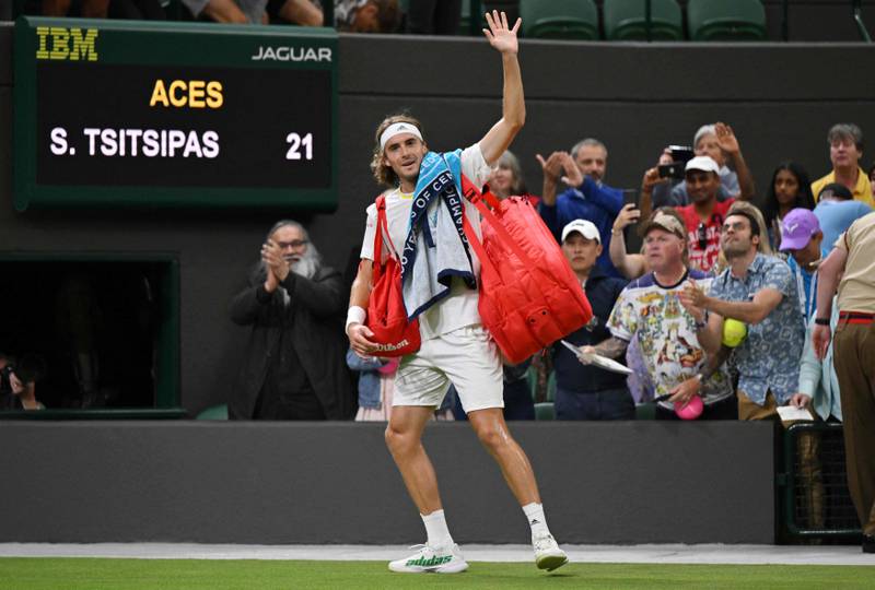Stefanos Tsitsipas waves to the crowd as he leaves Centre Court after being defeated by Nick Kyrgios. AFP