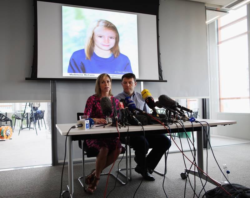 Kate and Gerry McCann speak in front of an age-progressed police image of their daughter during a news conference to mark the fifth anniversary of her disappearance, in May 2012 in London.