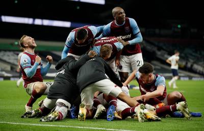 Manuel Lanzini is mobbed by teammates after his late goal. Getty