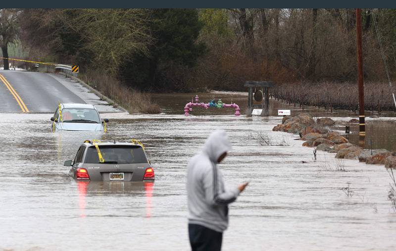Cars submerged after heavy rain moved through Windsor near San Francisco. Getty / AFP