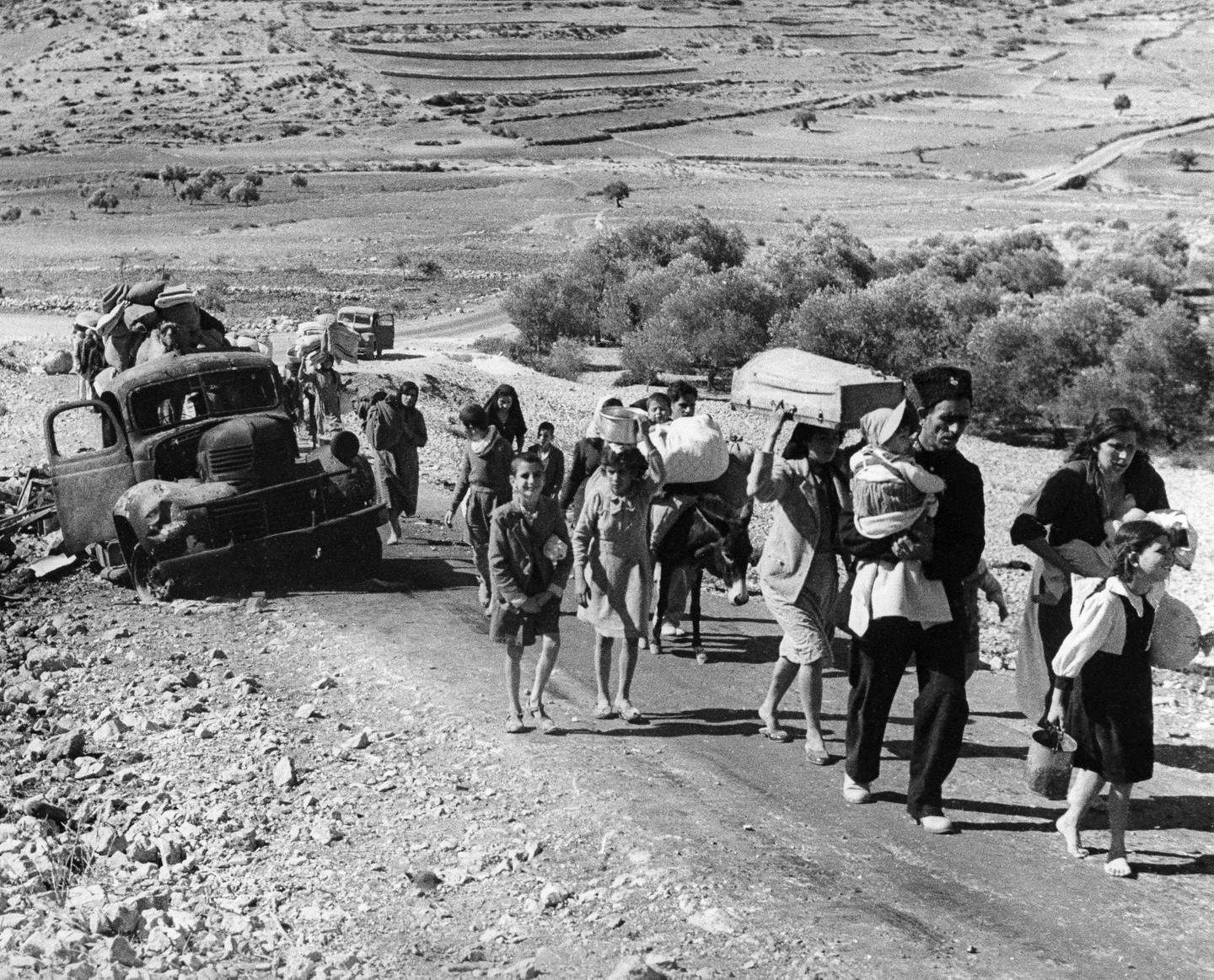 Arab refugees stream from Palestine on the Lebanon Road, Nov. 4, 1948. These are Arab villagers who fled from their homes during the recent fighting in Galilee between Israel and Arab troops. (AP / Jim Pringle)