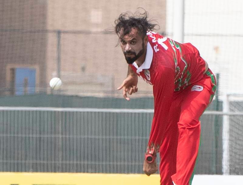 Bilal Khan bowls for Oman against the UAE during the Cricket World Cup League 2 match at the ICC Academy in Dubai. 