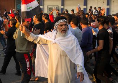 Iraqis demonstrate outside the Basra Governorate's building in the southern city of Basra. The United Nations' top official in Iraq and the country's most senior cleric urged authorities to get "serious" about reforms after anti-government demonstrations that have left hundreds dead.  AFP