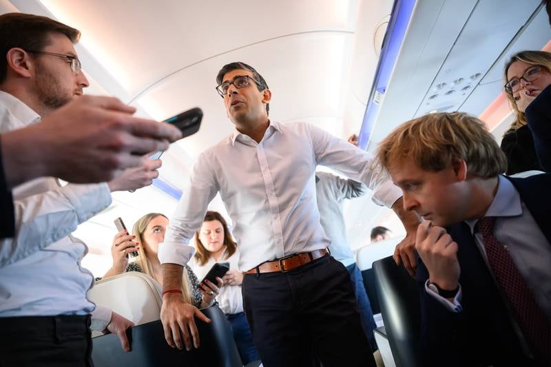 UK Prime Minister Rishi Sunak onboard a plane bound for San Diego on Sunday. Getty Images