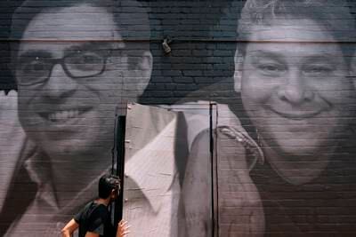 A mural in Washington shows Iranian-American citizen Siamak Namazi, left, who has held in Iran since 2015. AP