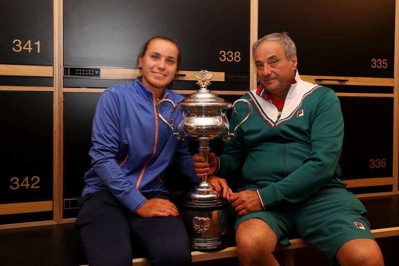 MELBOURNE, AUSTRALIA - FEBRUARY 01: Sofia Kenin and her coach and father Alexander Kenin pose with the Daphne Akhurst Trophy in the locker room after winning her Women's Singles Final match against Garbine Muguruza of Spain on day thirteen of the 2020 Australian Open at Melbourne Park on February 01, 2020 in Melbourne, Australia. (Photo by Hannah Peters/Getty Images)