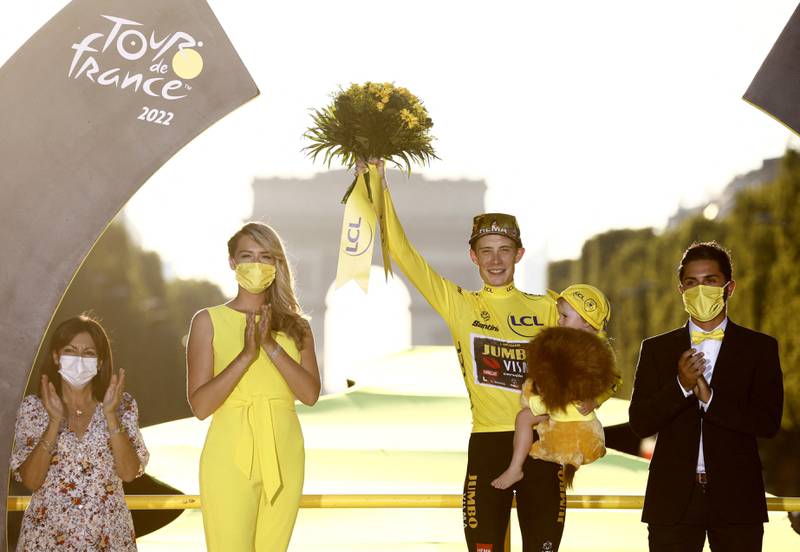Jumbo-Visma's Jonas Vingegaard celebrates on the podium after winning the 2022 Tour de France, on Sunday, July 24. Reuters