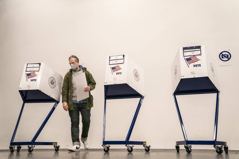 A voter goes to cast their vote after filling out their ballot at a polling station inside The Shed arts centre in Manhattan. AP