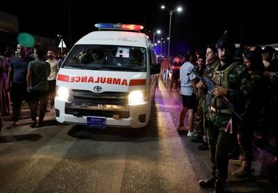 Security forces keep watch next to an ambulance. Reuters