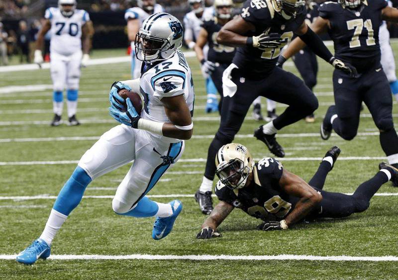 Carolina Panthers wide receiver Devin Funchess (17) scores a touchdown in front of New Orleans Saints cornerback Brandon Browner (39), New Orleans Saints linebacker James Anderson (42) and defensive tackle Kaleb Eulls (71) in the second half of an NFL football game in New Orleans, Sunday, Dec. 6, 2015. (AP Photo/Bill Feig)