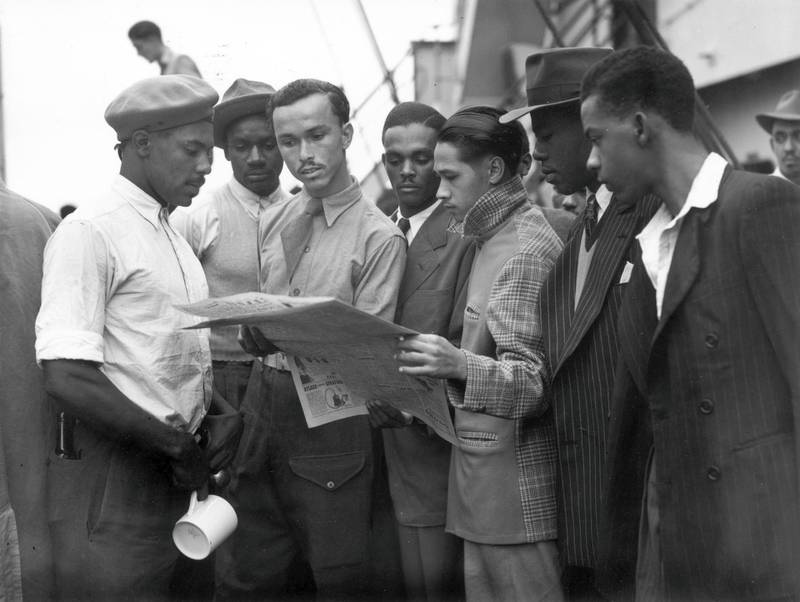 22nd June 1948:  Newly arrived Jamaican immigrants on board the 'Empire Windrush' at Tilbury.  (Photo by Douglas Miller/Keystone/Getty Images)