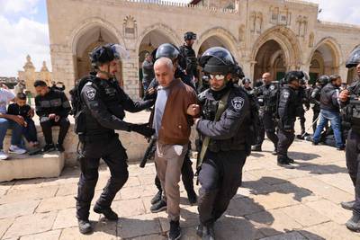 Israeli police detain a man after violence broke out during a visit by a group of Jewish people to the Al Aqsa mosque compound in the Old City of Jerusalem. All photos unless otherwise stated: AFP