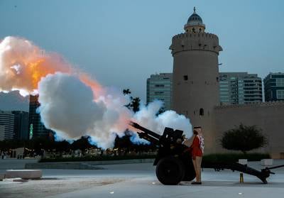 A cannon is fired on the final day of Ramadan 2022 at Abu Dhabi’s oldest building, Qasr Al Hosn, to signal prayers and the breaking of the day’s fast. Victor Besa / The National