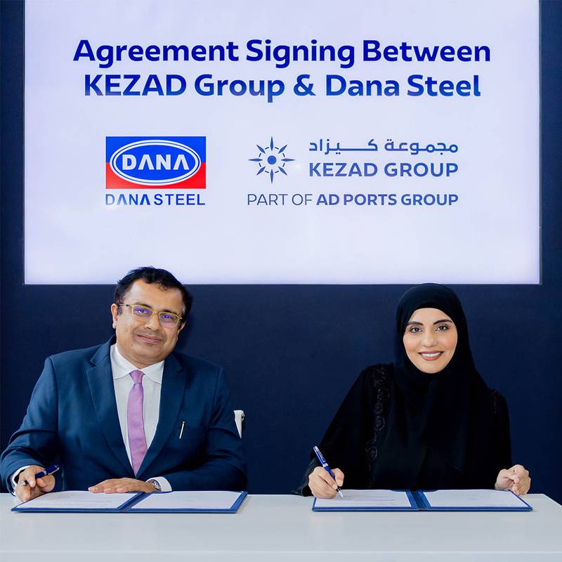 Fatima Al Hammadi, Kezad's chief commercial officer, and Ankur Dana, chief executive of Dana Steel Industry, sign the agreement to establish the company's first 'hot and cold rolling' steel complex in Abu Dhabi. Photo: AD Ports Group