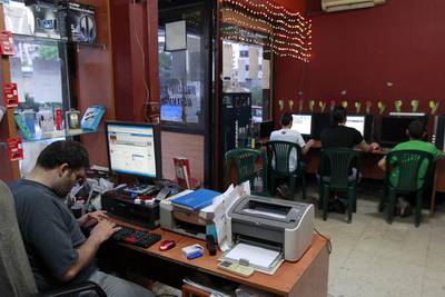Young Lebanese surf the web at an internet cafe in Beirut. Across the Arab world, there are more than 55 million Facebook users. Nabil Mounzer / EPA
